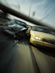High-impact car crash on highway with visible damage, highlighting injury claims for Louisville personal injury lawyer