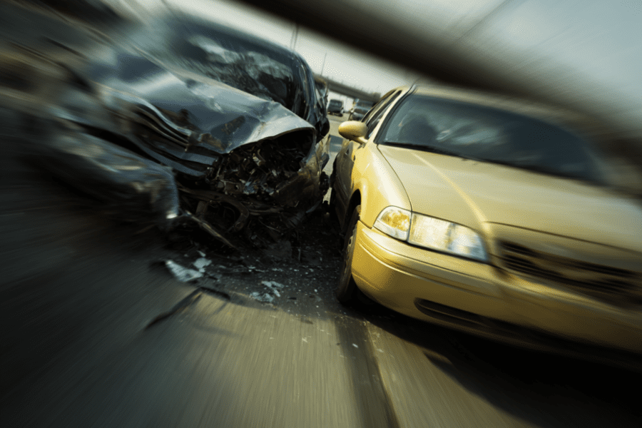 High-impact car crash on highway with visible damage, highlighting injury claims for Louisville personal injury lawyer