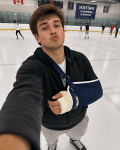 Louisville personal injury lawyer; Injured claimant taking selfie on a phone for social media while ice skating