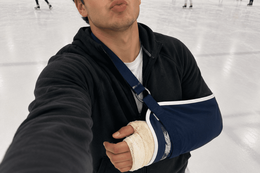 Louisville personal injury lawyer; Injured claimant taking selfie on a phone for social media while ice skating